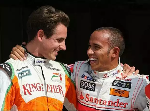 Titel-Bild zur News: Adrian Sutil und Lewis Hamilton