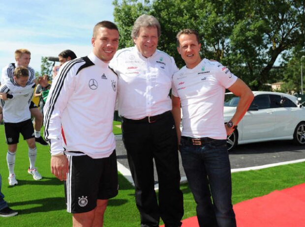 Lukas Podolski, Norbert Haug, Michael Schumacher