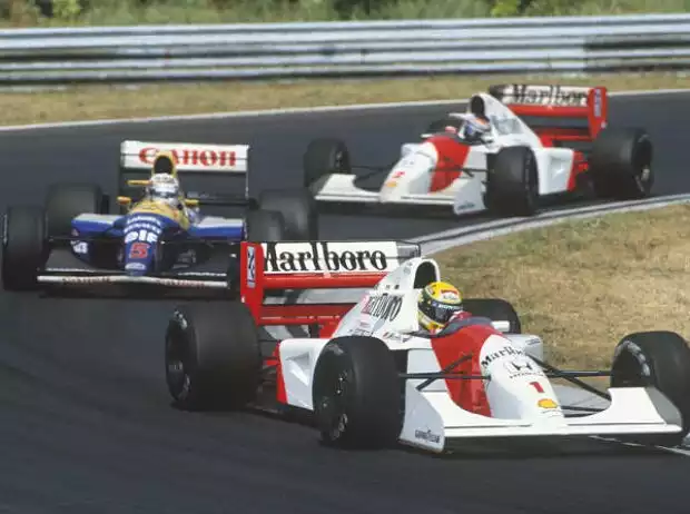 Titel-Bild zur News: Ayrton Senna vor Nigel Mansell und Gerhard Berger in Budapest 1992