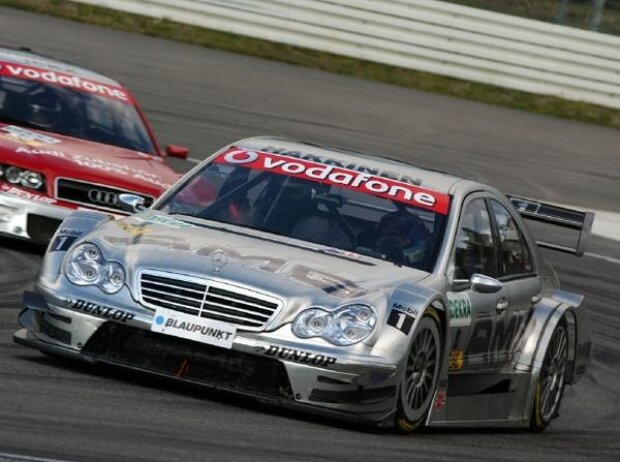 2006 DTM Championship. Round 10, Hockenheimring. 27th - 29th October 2006. Mika Häkkinen (FIN), AMG-Mercedes, AMG-Mercedes C-Klasse in front of Vanina Ickx (BEL), Team Midland, Audi A4 DTM