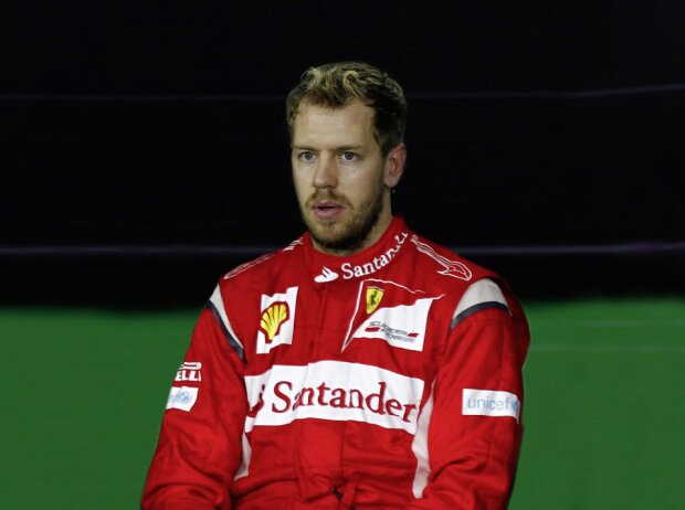 Sebastian Vettel im Ferrari-Overall (Fotomontage) Sebastian Vettel im Ferrari-Overall (Fotomontage)