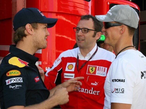 Michael Schumacher, Sebastian Vettel, Stefano Domenicali