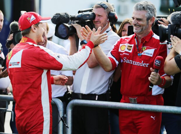 Titel-Bild zur News: Sebastian Vettel, Maurizio Arrivabene