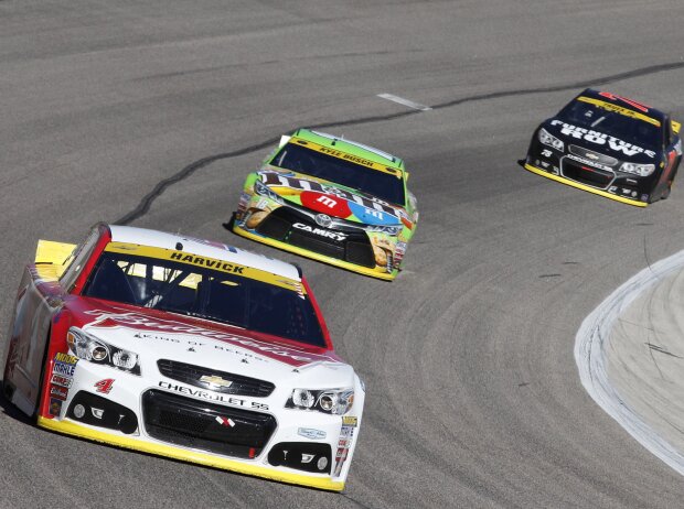 Kevin Harvick, Kyle Busch, Martin Truex Jun. Kevin Harvick, Kyle Busch, Martin Truex Jun.