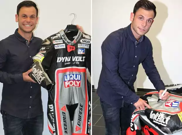 Sandro Cortese unterzeichnet seine Original-Lederkombi vom Aragon GP 2015 Titel-Bild zur News: Sandro Cortese unterzeichnet seine Original-Lederkombi vom Aragon GP 2015