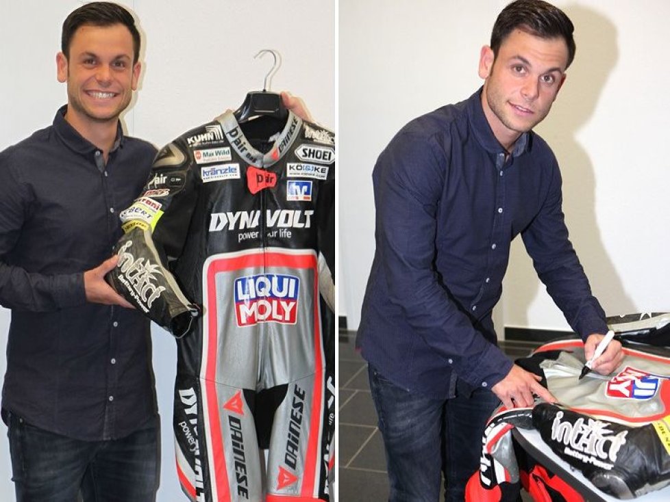 Sandro Cortese unterzeichnet seine Original-Lederkombi von Aragon GP 2015