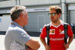 Sebastian Vettel (Ferrari) mit Dave Ryan (Manor)