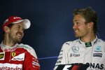 Sebastian Vettel (Ferrari) und Nico Rosberg (Mercedes) 