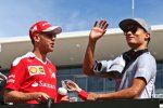 Sebastian Vettel (Ferrari) und Pascal Wehrlein (Manor) 
