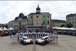 Gruppenfotos des Porsche-Teams