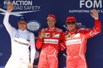 Sebastian Vettel (Ferrari), Kimi Räikkönen (Ferrari) und Valtteri Bottas (Mercedes) 