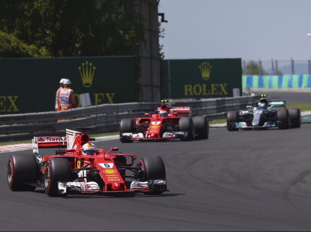 Titel-Bild zur News: Sebastian Vettel, Kimi Räikkönen, Valtteri Bottas