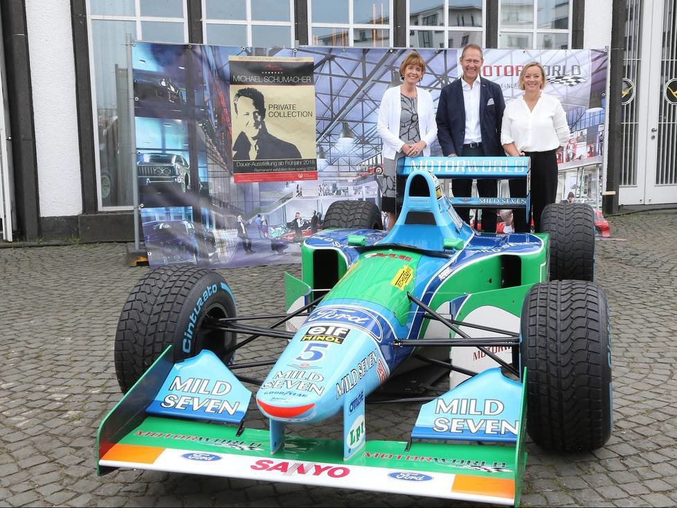 Henriette Reker, Andreas Dünkel, Sabine Kehm hinter Schumi-Benetton Ford