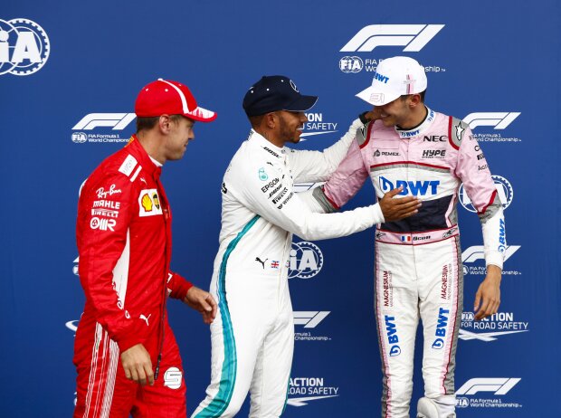 Titel-Bild zur News: Sebastian Vettel, Esteban Ocon, Lewis Hamilton