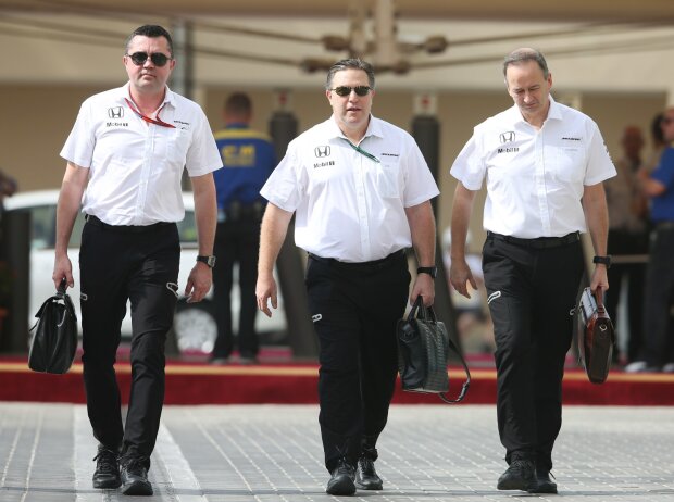 Eric Boullier, Zak Brown, Jonathan Neale Eric Boullier, Zak Brown, Jonathan Neale