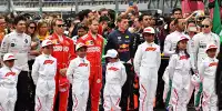F1-Fahrer mit Gridkids
