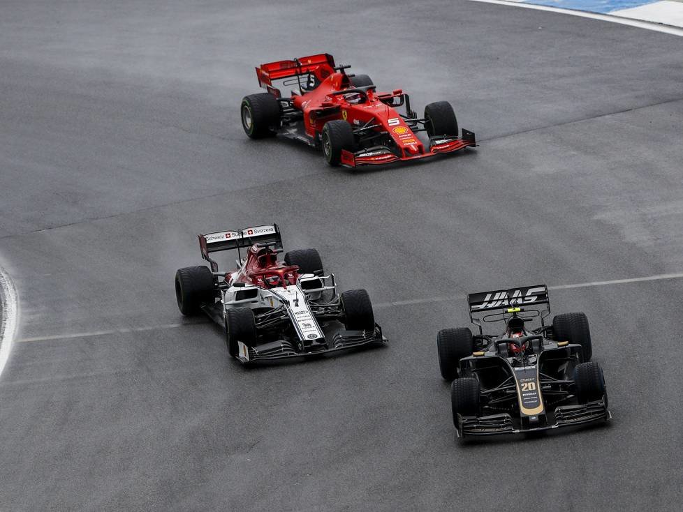 Kevin Magnussen, Kimi Räikkönen, Sebastian Vettel