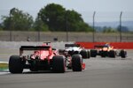 Lando Norris (McLaren), Romain Grosjean (Haas) und Sebastian Vettel (Ferrari) 