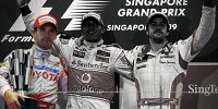 Timo Glock, Lewis Hamilton und Fernando Alonso auf dem Podium in Singapur 2009