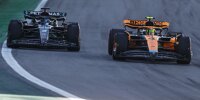George Russell im Mercedes W14 neben Lando Norris im McLaren MCL60 beim Formel-1-Sprint in Brasilien 2023