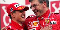 Michael Schumacher und Ross Brawn auf dem Formel-1-Podium in Suzuka