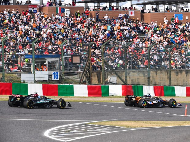 Titel-Bild zur News: Oscar Piastri (McLaren MCL38) vor George Russell (Mercedes W15) beim Formel-1-Rennen in Japan 2024