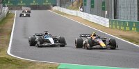 Sergio Perez (Red Bull RB20) und George Russell (Mercedes W15) beim Formel-1-Rennen in Japan 2024