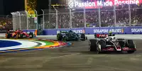 Nico Hülkenberg (Haas), Fernando Alonso (Aston Martin), Charles Leclerc (Ferrari) beim Formel-1-Rennen in Singapur 2024