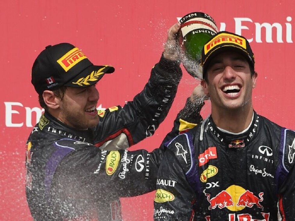 Sebastian Vettel und Daniel Ricciardo feiern auf dem Formel-1-Poidum in Kanada 2014