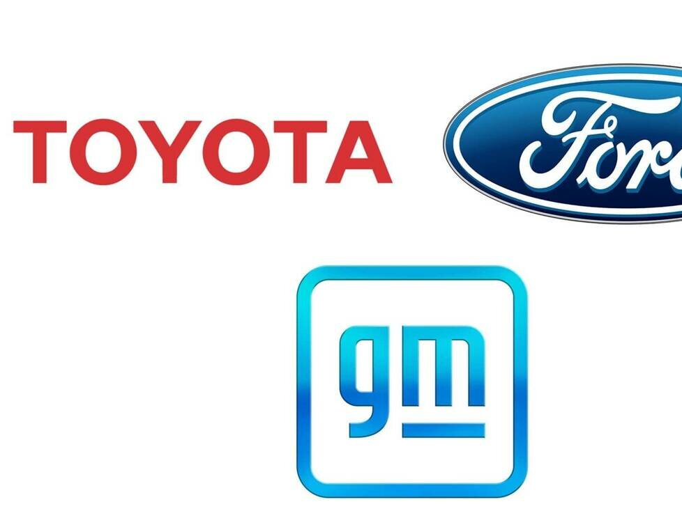 Logos von Toyota, Ford und GM