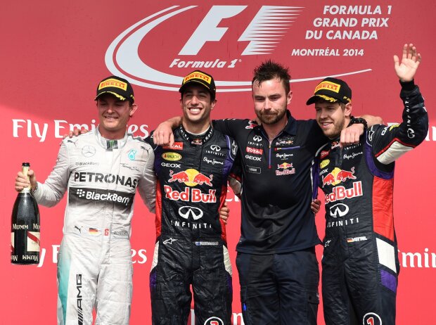 Erfahrener Mann: Rennie mit Ricciardo, bei dessen erstem Sieg in Kanada 2014 Erfahrener Mann: Rennie mit Ricciardo, bei dessen erstem Sieg in Kanada 2014